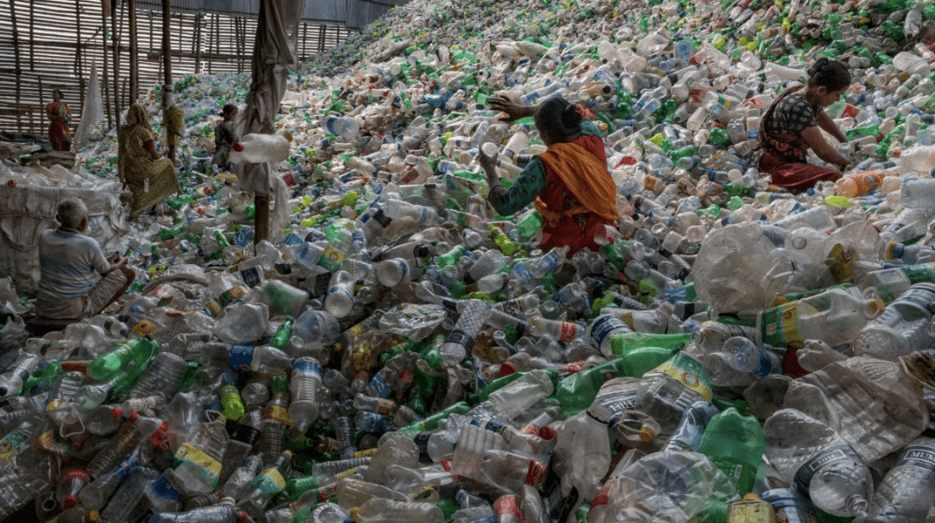 Photo: NatGeo - plastic sorting bottles by hand