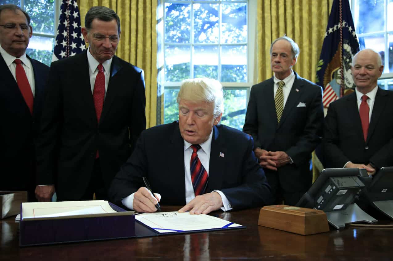 photo in Oval Office: President Donald Trump signs the "America's Water Infrastructure Act of 2018"