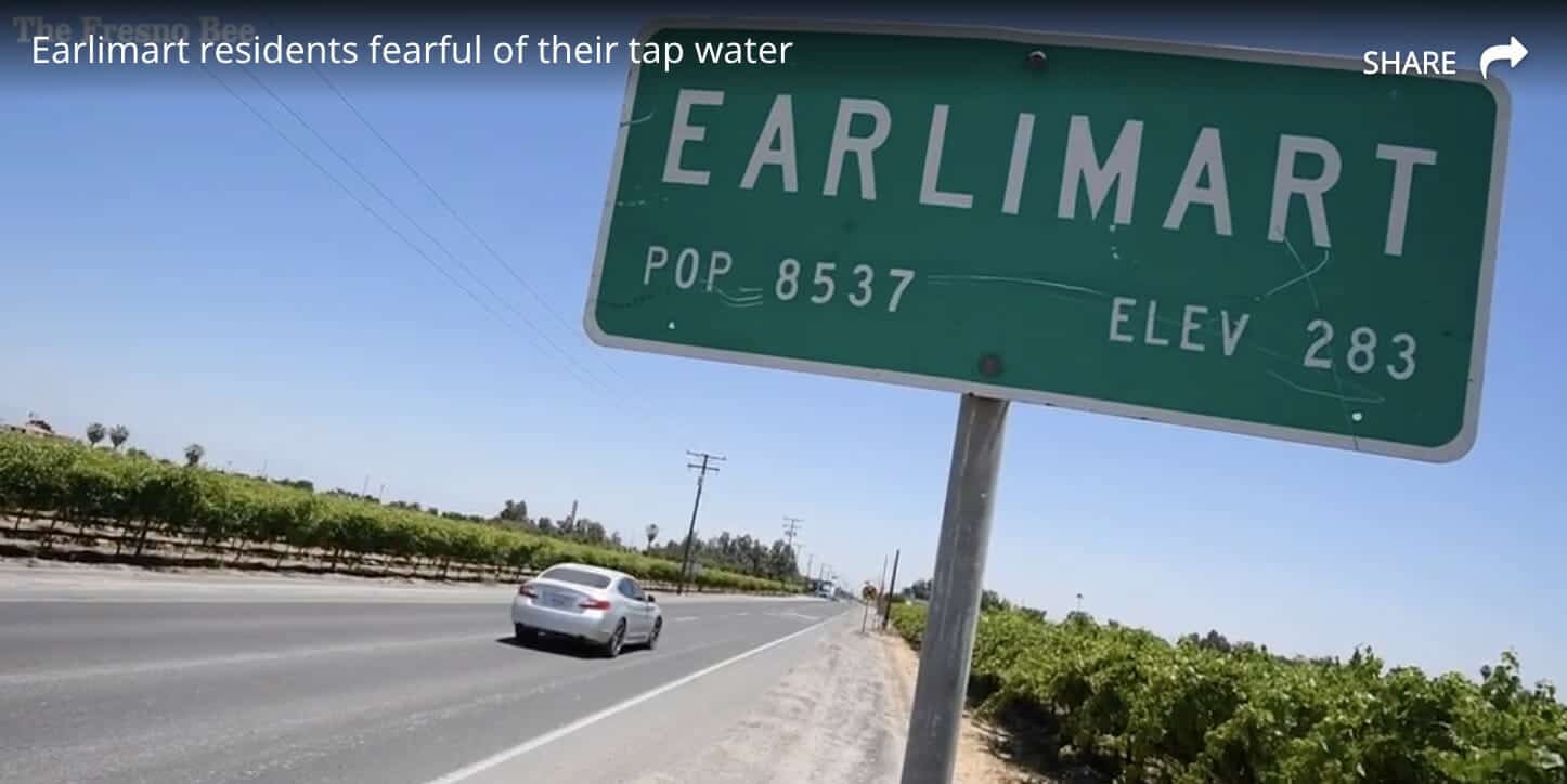 photo: sign announcing the town of Earlimart, California